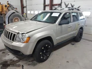 2010 Jeep Grand Cherokee Laredo with VIN 1J4PR4GK9AC160097, listed as a IAAI auction lot 41883264 with 240,409 mi miles. Bid and sale history available at carsss.com. Image 2.