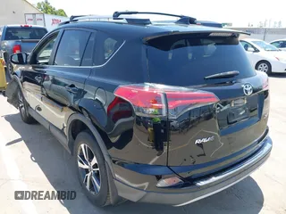 2018 Toyota RAV4 XLE with VIN 2T3WFREV2JW447623, listed as a IAAI auction lot 42410168 with 84,800 mi miles and . Bid and sale history available at DreamBid. Image 3.
