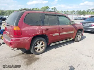 2004 GMC Envoy SLT with VIN 1GKDS13SX42334503, listed as a IAAI auction lot 42038781 with 242,680 mi miles. Bid and sale history available at carsss.com. Image 4.