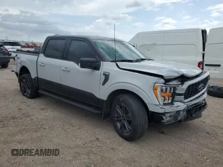 2023 Ford F-150 XL with VIN 1FTFW1E84PKE35275, listed as a Copart auction lot 61867535 with 22,142 mi miles and Salvage title. Bid and sale history available at DreamBid. Image 4.