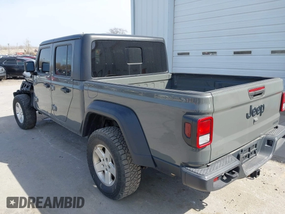 2020 Jeep Gladiator Sport S z VIN 1C6HJTAG7LL154664, wystawiony jako IAAI lot #42033131 z przebiegiem 73 282 mil mil oraz . Historia ofert i sprzedaży dostępna na DreamBid. Obrazek 3.
