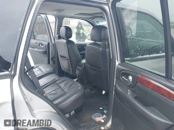 2005 GMC Envoy SLT with VIN 1GKDT13S352258640, listed as a IAAI auction lot 41226997 with 159,665 mi miles. Bid and sale history available at carsss.com. Image 8.