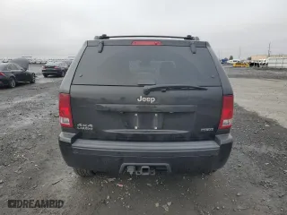 2010 Jeep Grand Cherokee Laredo with VIN 1J4RR4GT7AC120604, listed as a Copart auction lot 84257724 with 60,827 mi miles and Salvage Title. Bid and sale history available at carsss.com. Image 6.