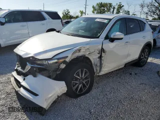 2018 Mazda CX-5 Touring z VIN JM3KFACM2J0330064, wystawiony jako Copart lot #57185565 z przebiegiem 89 890 mil mil oraz Szkoda całkowita • Salvage title. Historia ofert i sprzedaży dostępna na DreamBid. Obrazek 1.