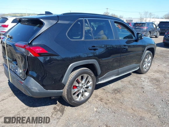 2021 Toyota RAV4 XLE Premium with VIN 2T3A1RFV6MC236809, listed as a IAAI auction lot 42056379 with 99,921 mi miles and . Bid and sale history available at DreamBid. Image 4.