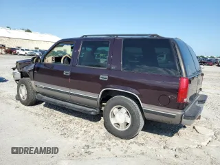 1997 GMC Yukon with VIN 1GKEK13R7VJ711782, listed as a Copart auction lot 74793184 with 208,718 mi miles and Salvage Title. Bid and sale history available at carsss.com. Image 2.