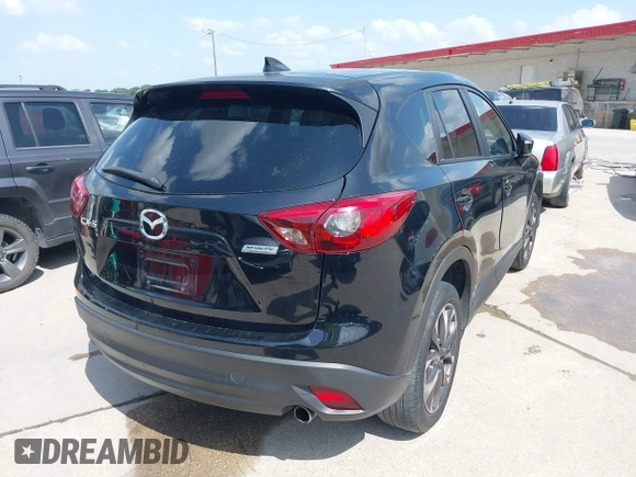 2016 Mazda CX-5 Grand Touring z VIN JM3KE2DY2G0765444, wystawiony jako IAAI lot #42527577 z przebiegiem 162 871 mil mil oraz . Historia ofert i sprzedaży dostępna na DreamBid. Obrazek 4.