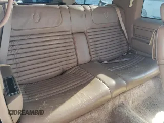 1988 Cadillac Eldorado with VIN 1G6EL1153JU612185, listed as a Copart auction lot 83786144 with 133,882 mi miles and Salvage Title. Bid and sale history available at DreamBid. Image 10.