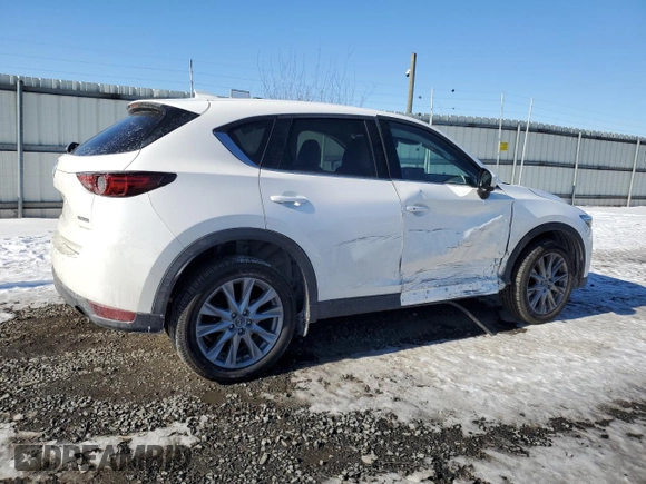 2021 Mazda CX-5 Grand Touring with VIN JM3KFBDM3M1305807, listed as a Copart auction lot 42713655 with 58,162 mi miles and Salvage Title. Bid and sale history available at DreamBid. Image 3.