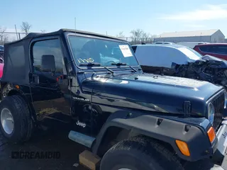 2002 Jeep Wrangler X with VIN 1J4FA39S52P770664, listed as a IAAI auction lot 41661580 with 122,445 mi miles. Bid and sale history available at carsss.com. Image 13.