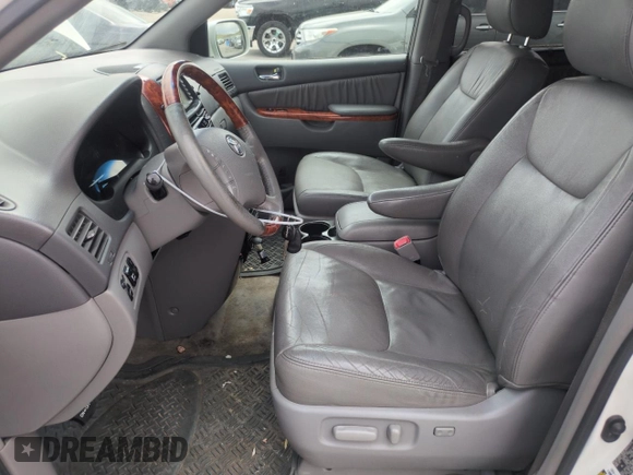 2010 Toyota Sienna XLE with VIN 5TDDK4CC5AS032076, listed as a Copart auction lot 57675555 with 210,252 mi miles and Clean title. Bid and sale history available at DreamBid. Image 7.