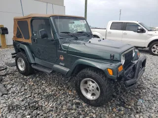 2002 Jeep Wrangler Sahara with VIN 1J4FA59S52P763290, listed as a Copart auction lot 59115665 with 129,479 mi miles and Non repairable. Bid and sale history available at DreamBid. Image 4.
