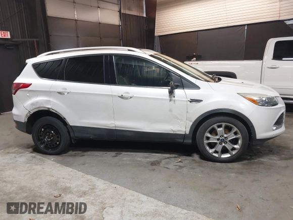 2016 Ford Escape Titanium with VIN 1FMCU9J94GUB02810, listed as a IAAI auction lot 41643907 with 119,684 mi miles. Bid and sale history available at carsss.com. Image 12.
