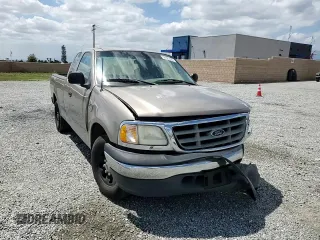 2001 Ford F-150 with VIN 1FTPX17L21NA37619, listed as a Copart auction lot 56922485 with 212,148 mi miles and Salvage title. Bid and sale history available at DreamBid. Image 14.