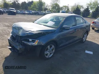 2013 Volkswagen Jetta TDI w/Premium z VIN 3VWLL7AJ6DM291317, wystawiony jako IAAI lot #42091621 z przebiegiem 169 448 mil mil oraz . Historia ofert i sprzedaży dostępna na DreamBid. Obrazek 17.