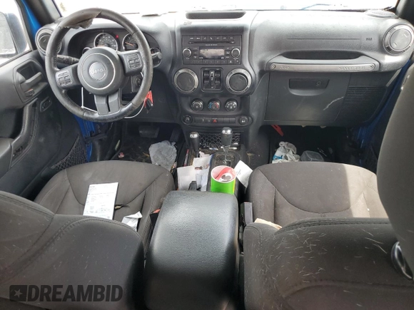 2015 Jeep Wrangler Unlimited Willys Wheeler with VIN 1C4BJWDG4FL611656, listed as a Copart auction lot 54010395 with 129,797 mi miles and Salvage Title. Bid and sale history available at DreamBid. Image 8.
