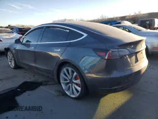 2019 Tesla Model 3 Long Range with VIN 5YJ3E1EB8KF477004, listed as a Copart auction lot 86192984 with 0 mi miles and Salvage Title. Bid and sale history available at carsss.com. Image 2.