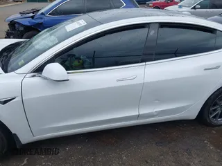 2019 Tesla Model 3 Mid Range with VIN 5YJ3E1EA5KF397098, listed as a IAAI auction lot 41943570 with 72,046 mi miles and . Bid and sale history available at DreamBid. Image 19.