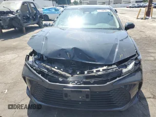 2025 Toyota Camry LE z VIN 4T1DAACK6SU024733, wystawiony jako Copart lot #59023475 z przebiegiem 6 697 mil mil oraz Czysty tytuł • Clean title. Historia ofert i sprzedaży dostępna na DreamBid. Obrazek 5.