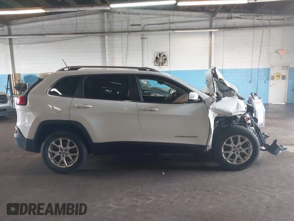 2015 Jeep Cherokee Latitude with VIN 1C4PJMCBXFW784869, listed as a IAAI auction lot 41951297 with 138,396 mi miles. Bid and sale history available at carsss.com. Image 13.