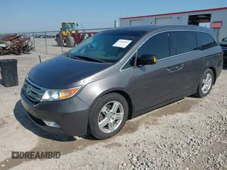 2013 Honda Odyssey Touring with VIN 5FNRL5H98DB080296, listed as a IAAI auction lot 42461843 with 104,901 mi miles and . Bid and sale history available at DreamBid. Image 2.