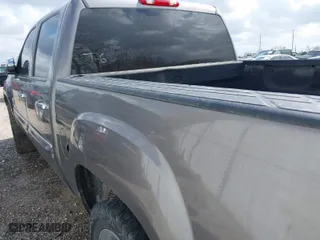 2011 GMC Sierra 1500 SLE with VIN 3GTP1VE06BG260158, listed as a IAAI auction lot 41627265 with 127,895 mi miles. Bid and sale history available at carsss.com. Image 3.
