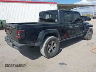 2021 Jeep Gladiator Willys with VIN 1C6HJTAG7ML523718, listed as a IAAI auction lot 42206058 with 48,071 mi miles and . Bid and sale history available at DreamBid. Image 4.