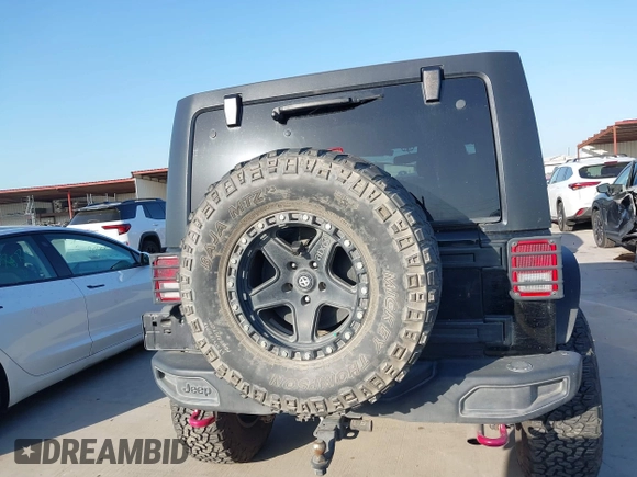 2015 Jeep Wrangler Unlimited Rubicon Hard Rock with VIN 1C4HJWFG7FL602344, listed as a IAAI auction lot 42011914 with 109,238 mi miles and . Bid and sale history available at DreamBid. Image 16.
