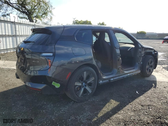 2023 BMW iX xDrive50 with VIN WB523CF02PCM92379, listed as a Copart auction lot 47726814 with 7,721 mi miles. Bid and sale history available at carsss.com. Image 3.