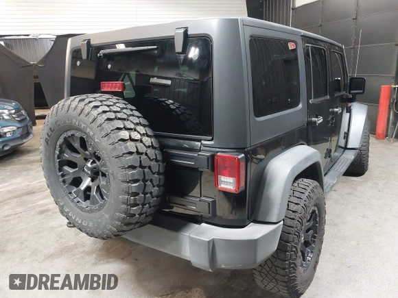 2015 Jeep Wrangler Unlimited Willys Wheeler with VIN 1C4BJWDG1FL749803, listed as a IAAI auction lot 41995132 with 156,595 mi miles and . Bid and sale history available at DreamBid. Image 4.