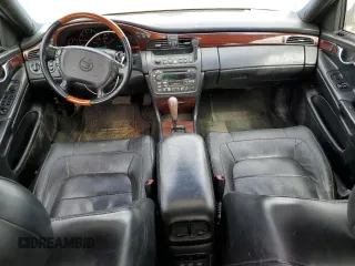 2004 Cadillac DeVille DTS z VIN 1G6KF57944U253624, wystawiony jako Copart lot #49444905 z przebiegiem 174 823 mil mil oraz Szkoda całkowita • Salvage title. Historia ofert i sprzedaży dostępna na DreamBid. Obrazek 8.