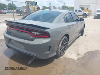 2019 Dodge Charger Scat Pack with VIN 2C3CDXGJ2KH633854, listed as a IAAI auction lot 42212517 with 74,285 mi miles and . Bid and sale history available at DreamBid. Image 4.