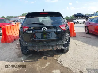 2016 Mazda CX-5 Touring with VIN JM3KE2CY5G0653108, listed as a IAAI auction lot 37717249 with 90,704 mi miles and . Bid and sale history available at DreamBid. Image 6.