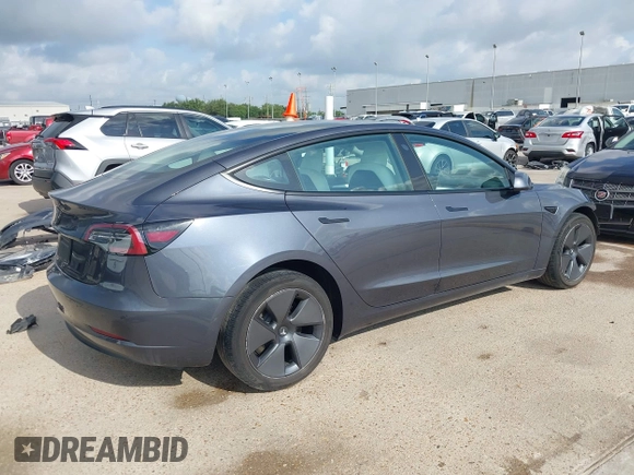 2023 Tesla Model 3 with VIN 5YJ3E1EA7PF567906, listed as a IAAI auction lot 42280993 with 41,452 mi miles and . Bid and sale history available at DreamBid. Image 4.