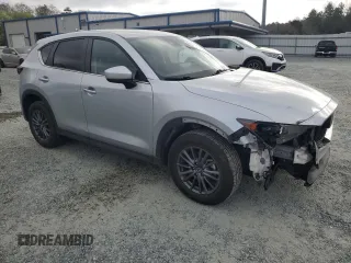2021 Mazda CX-5 Touring with VIN JM3KFACM2M0451083, listed as a Copart auction lot 49999935 with 59,927 mi miles and Salvage Title. Bid and sale history available at carsss.com. Image 4.