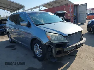 2007 Honda Odyssey EX z VIN 5FNRL38417B090312, wystawiony jako IAAI lot #42769930 z przebiegiem 191 407 mil mil oraz . Historia ofert i sprzedaży dostępna na DreamBid. Obrazek 1.