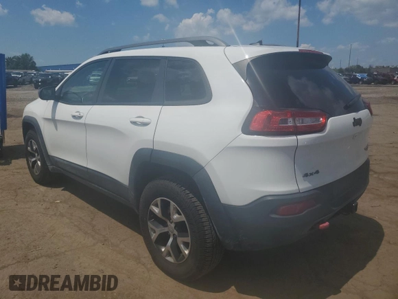 2015 Jeep Cherokee Trailhawk with VIN 1C4PJMBSXFW651000, listed as a Copart auction lot 64110515 with 135,571 mi miles and Clean title. Bid and sale history available at DreamBid. Image 2.