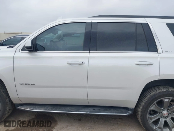 2019 GMC Yukon SLT with VIN 1GKS1BKCXKR329607, listed as a IAAI auction lot 41188239 with 84,940 mi miles. Bid and sale history available at carsss.com. Image 14.