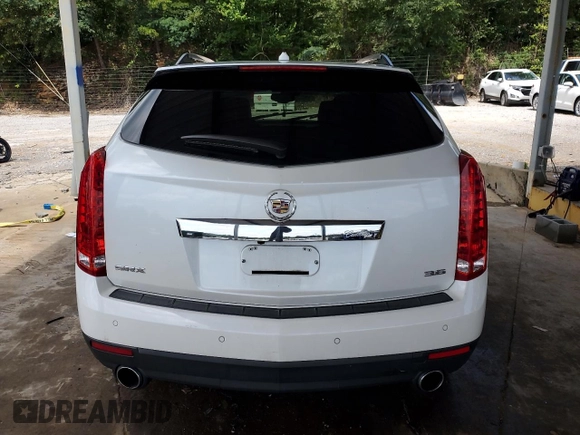 2013 Cadillac SRX Premium Collection with VIN 3GYFNEE30DS529808, listed as a Copart auction lot 61931185 with 131,245 mi miles and Salvage title. Bid and sale history available at DreamBid. Image 6.