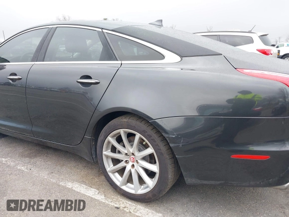 2014 Jaguar XJ with VIN SAJWA1CZ0E8V73966, listed as a IAAI auction lot 41887234 with 120,804 mi miles and . Bid and sale history available at DreamBid. Image 6.