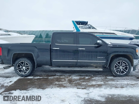 2014 GMC Sierra 1500 Denali z VIN 3GTU2WEC9EG310426, wystawiony jako IAAI lot #41616941 z przebiegiem 115 808 mil mil oraz . Historia ofert i sprzedaży dostępna na DreamBid. Obrazek 13.