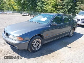 2000 BMW 5 Series 528iA with VIN WBADM6344YGU26491, listed as a IAAI auction lot 40301317 with 157,798 mi miles. Bid and sale history available at carsss.com. Image 2.