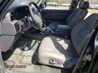 1995 Toyota Land Cruiser z VIN JT3DJ81W9S0112464, wystawiony jako Copart lot #49925395 z przebiegiem 215 698 mil mil oraz Czysty tytuł • Clean title. Historia ofert i sprzedaży dostępna na DreamBid. Obrazek 7.