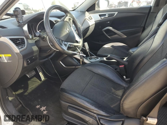 2013 Hyundai Veloster w/Gray Int z VIN KMHTC6ADXDU127194, wystawiony jako Copart lot #51751345 z przebiegiem 122 221 mil mil oraz Szkoda całkowita • Salvage title. Historia ofert i sprzedaży dostępna na DreamBid. Obrazek 7.