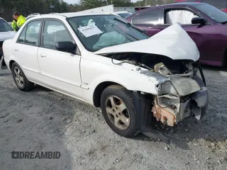 2000 Mazda Protege DX with VIN JM1BJ2221Y0208156, listed as a IAAI auction lot 41609657 with 435,304 mi miles and . Bid and sale history available at DreamBid. Image 1.