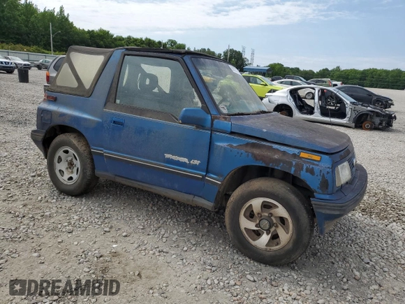 1993 Geo Tracker z VIN 2CNBJ18UXP6921660, wystawiony jako Copart lot #58027275 z przebiegiem 64 349 mil mil oraz Tytuł czysty. Historia ofert i sprzedaży dostępna na DreamBid. Obrazek 4.