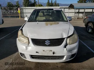 2011 Suzuki SX4 LE with VIN JS2YC5A21B6300207, listed as a Copart auction lot 77040354 with 162,915 mi miles and Salvage Title. Bid and sale history available at carsss.com. Image 5.