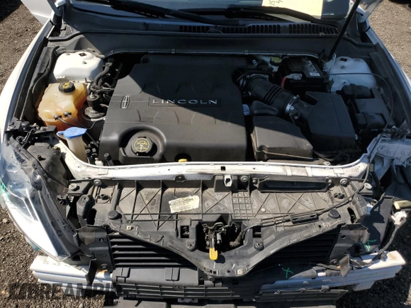 2015 Lincoln MKZ z VIN 3LN6L2JK8FR616661, wystawiony jako Copart lot #61588325 z przebiegiem 65 382 mil mil oraz Szkoda całkowita • Salvage title. Historia ofert i sprzedaży dostępna na DreamBid. Obrazek 11.