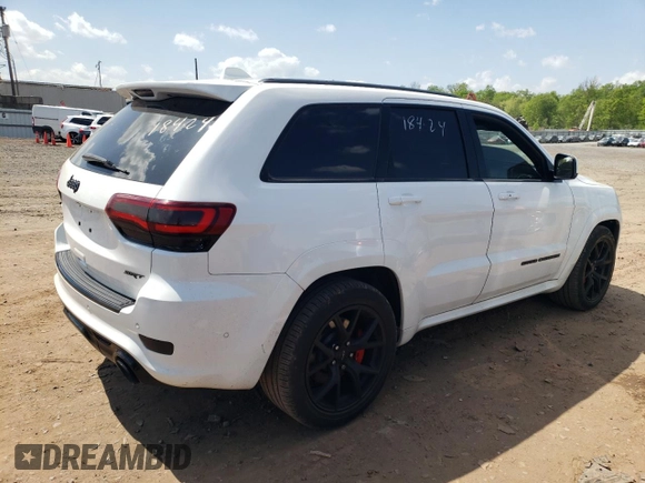 2018 Jeep Grand Cherokee with VIN NJ1449E, listed as a Copart auction lot 51357834 with 32,619 mi miles and Salvage title. Bid and sale history available at DreamBid. Image 3.
