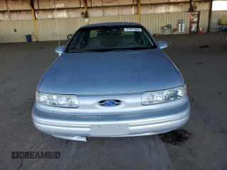 1995 Ford Taurus GL z VIN 1FALP524XSG154141, wystawiony jako Copart lot #77271544 z przebiegiem 72 118 mil mil oraz Czysty tytuł • Clean title. Historia ofert i sprzedaży dostępna na DreamBid. Obrazek 5.